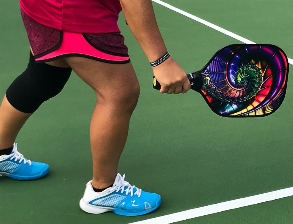Pickleball racket, shoes and court